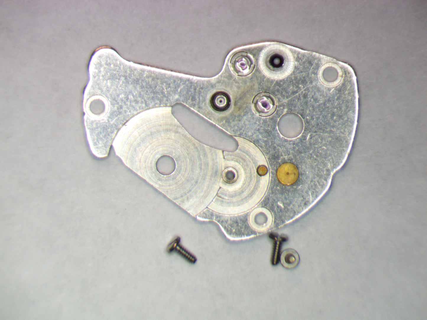 Seiko 7S26A 0112300 Barrel and train wheel bridge w/screws