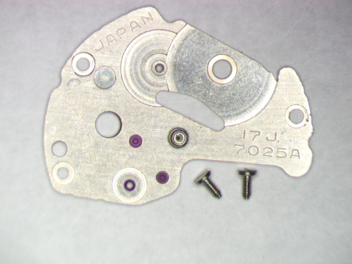 Seiko 7025A 112160 Barrel and train wheel bridge w/screws