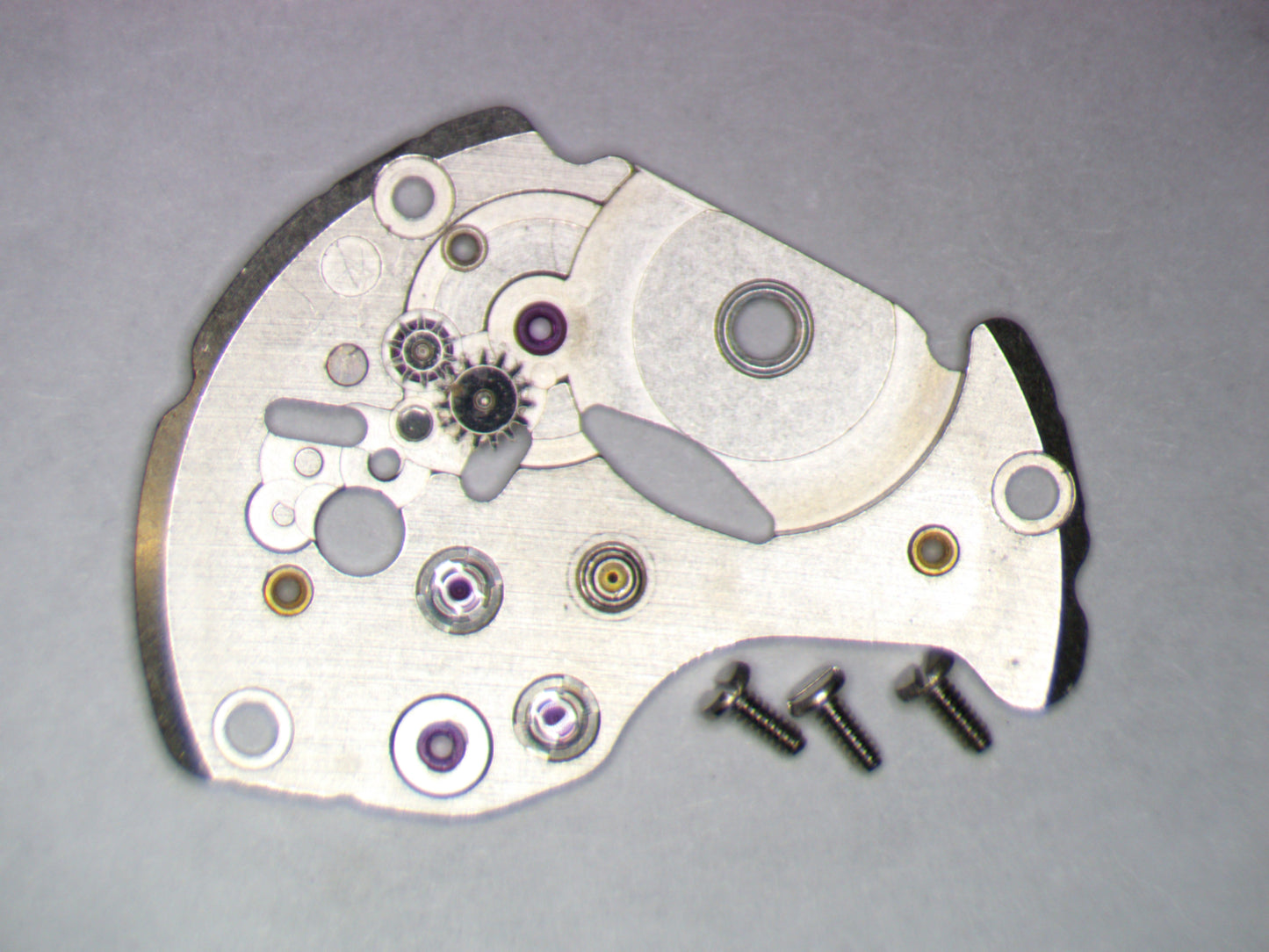 Seiko NH35A 0114183 Barrel and train wheel bridge w/screws