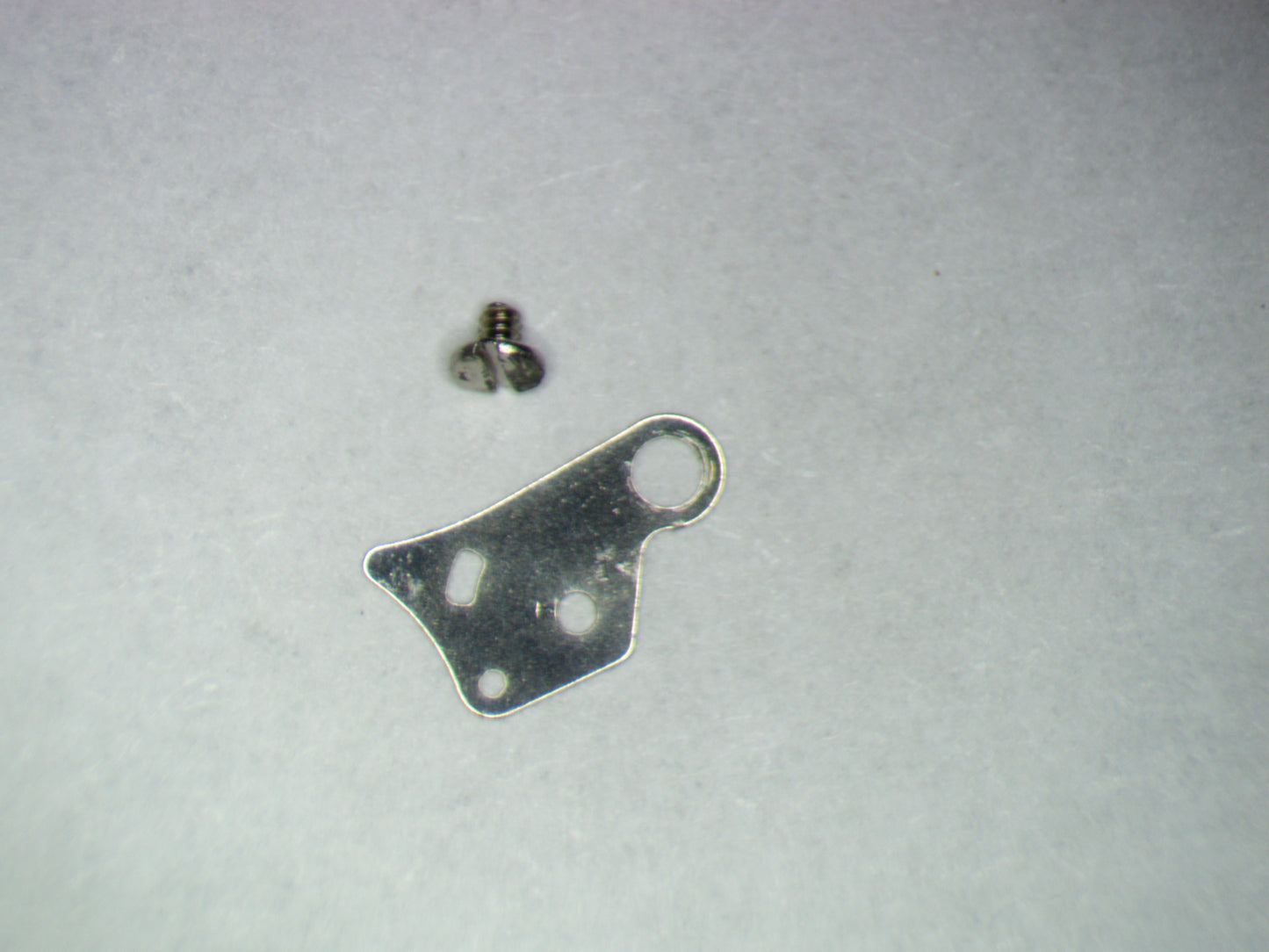 Seiko NH70A 0436166 Lower plate barrel train bridge w/screw