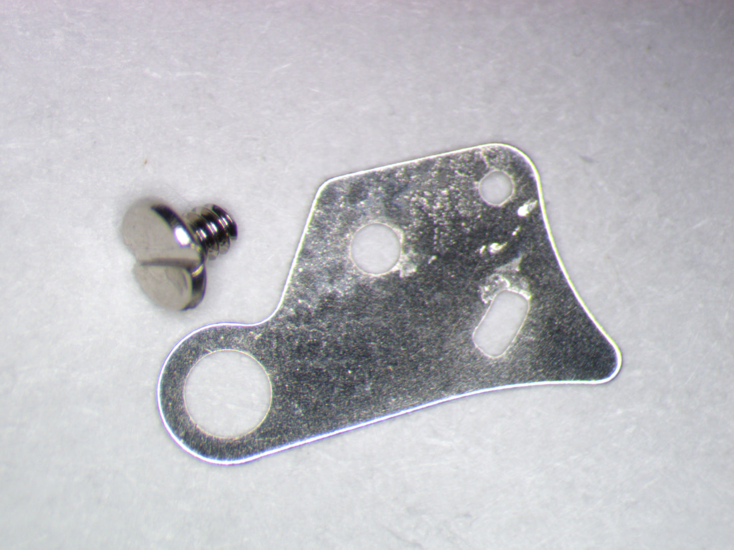 Seiko NH35A 0436166 Lower plate barrel train bridge w/screw